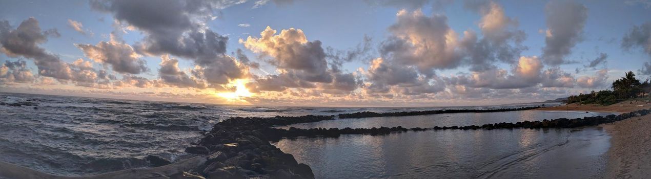 Sunrise at Lydgate Park Pools on Kauai.  The walled pools provide a barrier from high surf and dangerous currents and harbor schools of colorful, relatively tame fish.