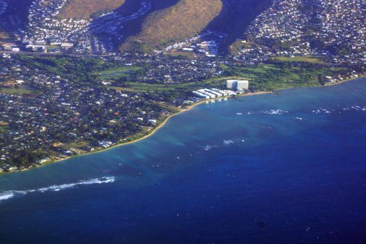 Aerial view of Kahala, and H-1 Highway, Hotel, Pacific ocean, clouds, and Golf Course on Oahu, Hawaii.