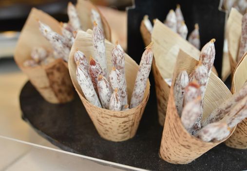 Dried sausages for sale at a local market in France