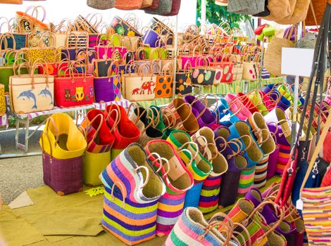 Colorful straw bags at a market in Provence France