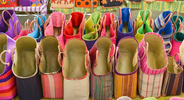 Colorful straw bags at a market in Provence,France