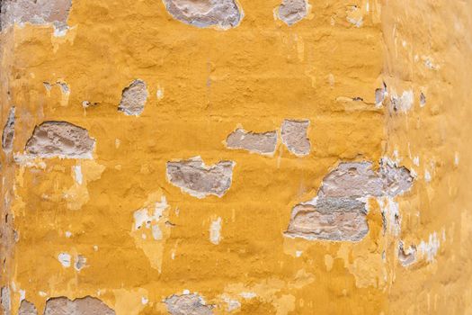 Yellow shabby wall background texture