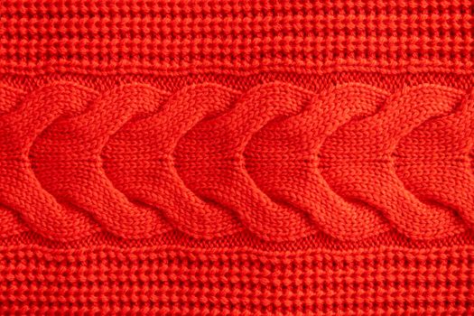 Red knitted winter sweater Background texture