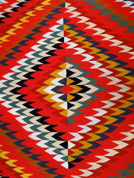 Pattern Red, Orange, White, Green, Black, and blue Diamond Blanket/ Rug - Navajo Artist, made about 1885 of cotton and wool.                              