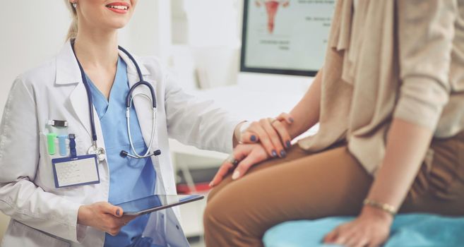 Doctor and patient discussing something while sitting at the table . Medicine and health care concept. Doctor and patient.
