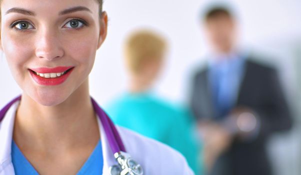 Woman doctor standing with stethoscope at hospital .