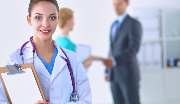 Woman doctor standing at hospital .