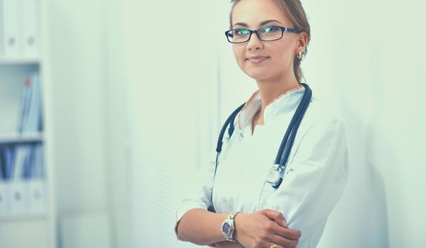 Portrait of woman doctor standing at hospital