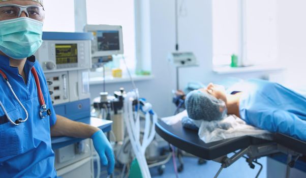 Male surgeon on background in operation room.