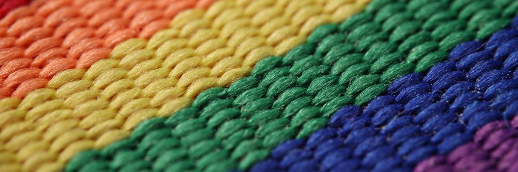 Close-up of rainbow lgbt carpet or flag symbol of bisexual homosexual gay lesbian transgender idea. Textile material, support lgbt. Gay movement concept