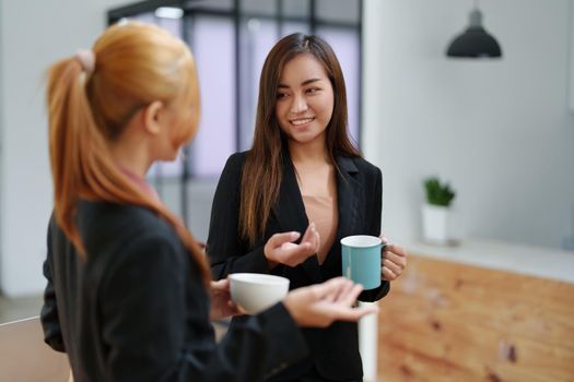 Portrait of an Asian businesswoman consulting, start up a marketing plan to meet the needs of customers in office room