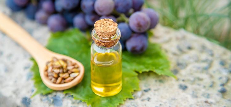 grape seed oil in a small jar. Selective focus.nature