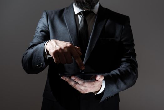 Man Holding Tablet And Pointing With One Finger On Important Message.