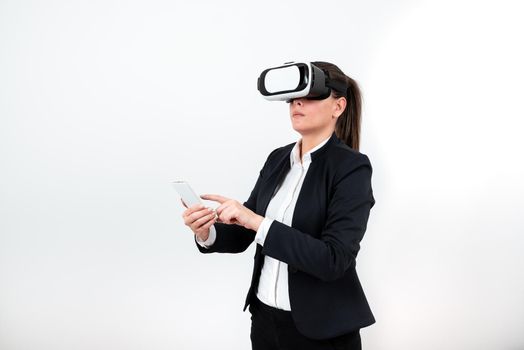 Woman With Vr Glasses And Mobile Phone Pointing On It With One Finger.