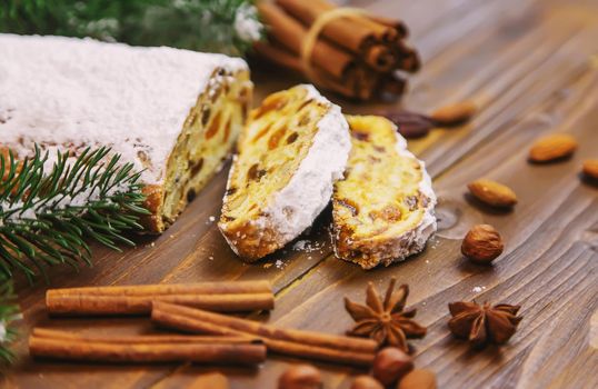 christmas stollen on wooden background. selective focus.holoday