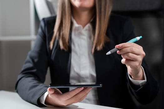 Woman Holding Tablet And Pointing With Pen On Important Idea.