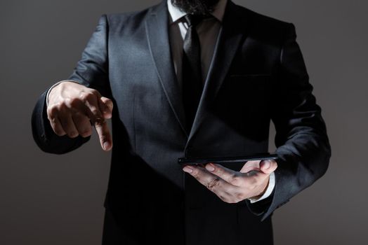 Man Holding Tablet And Pointing With One Finger On Important Message.