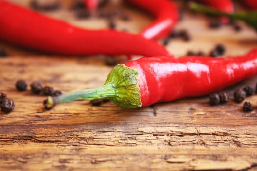 hot chili peppers on wooden background. selective focus.nature