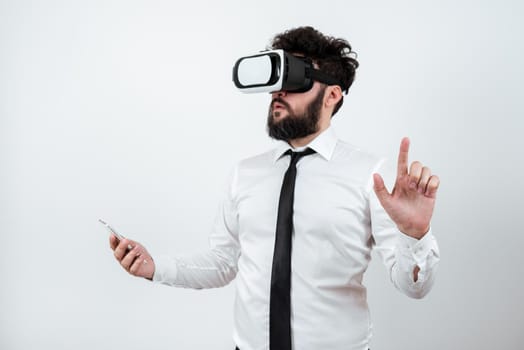 Man Holding Mobile Phone, Wearing Vr Glasses And Pointing On New Idea.