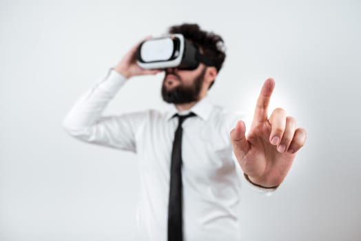 Man Wearing Vr Glasses And Pointing On Important Messages With One Finger.