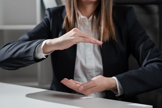 Sitting Businesswoman Holding Important Messages Between Hands.