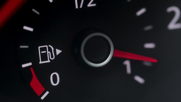 Fuel Gauge Car Dashboard Fills up. Red Light Turn On When Tank is Full or Vehicle Activated. Close Up petrol meter on black background.