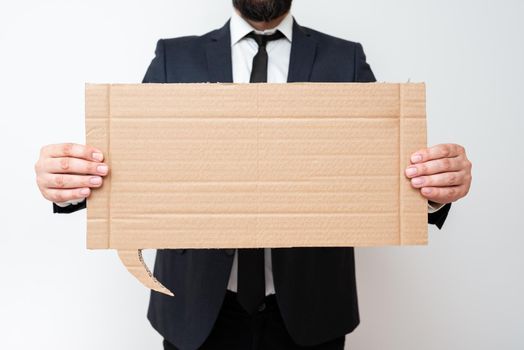 Businessman Holding Speech Bubble With Important Informations.