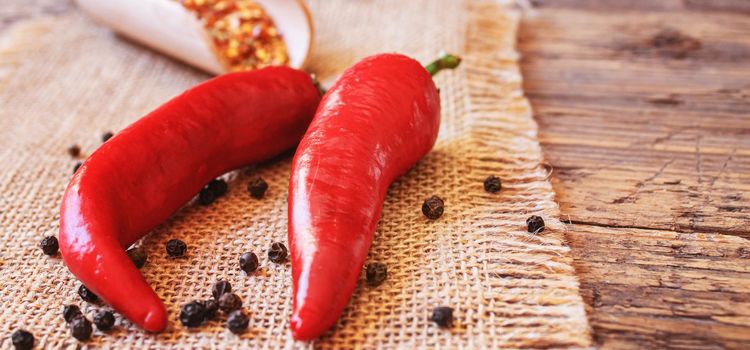 hot chili peppers on wooden background. selective focus.nature