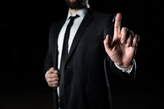 Businessman Pointing Important Infortmations With One Finger.