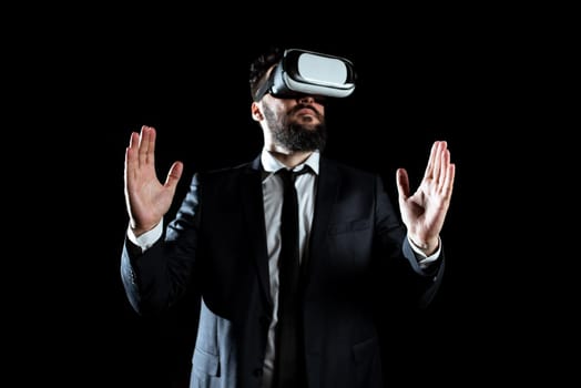 Businessman Wearing Suit Gesturing And Wearing Virtual Reality Simulator.