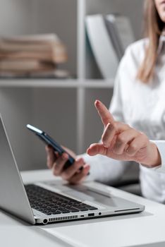 Businesswoman Holding Phone And Pointing With One Finger On Important News.