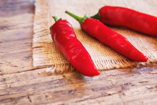 hot chili peppers on wooden background. selective focus.nature