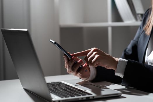 Woman Holding Tablet In One Hand And Pointing On News With One Finger.