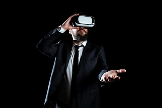 Businessman Wearing Suit Gesturing And Wearing Virtual Reality Simulator.