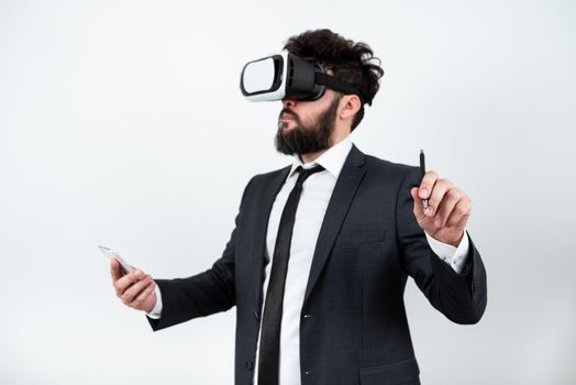 Man Holding Mobile Phone, Wearing Vr Glasses And Pointing On New Idea.