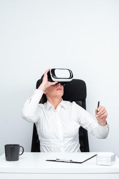 Woman Holding Pen And Learning Skill Through Virtual Reality Simulator.