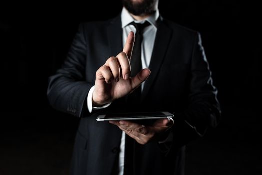 Businessman Holding Phone And Pointing With One Finger On Important Message