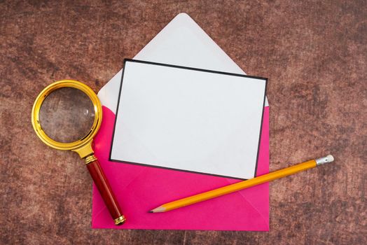 Letter With Envelope And Magnifying Glass Presenting Business Research.