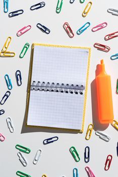 Important Message Written On Notebook With Colorful Paperclips Around.