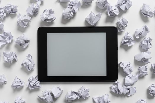 Tablet Screen With Important Message On It Surrounded With Paper Wraps.