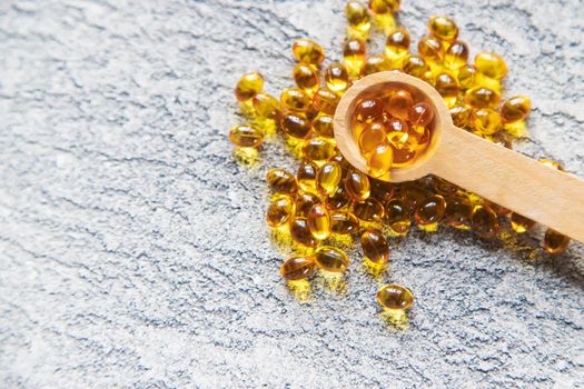 Vitamin D from fish oil capsules. Selective focus medical