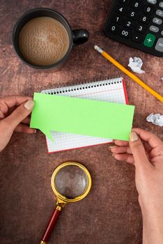 Hands Of Woman With Thought Bubble, Coffee Cup And Stationery Over Wood.