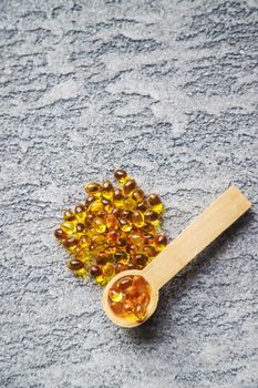 Vitamin D from fish oil capsules. Selective focus medical