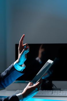 Businesswoman Holding Tablet And Pointing With One Finger On Important News