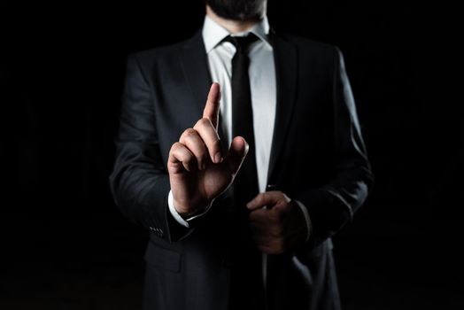 Businessman In Suit Pointing With One Finger On Important Message.