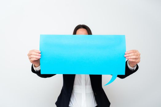 Businesswoman Holding Speech Bubble With Important Messages.