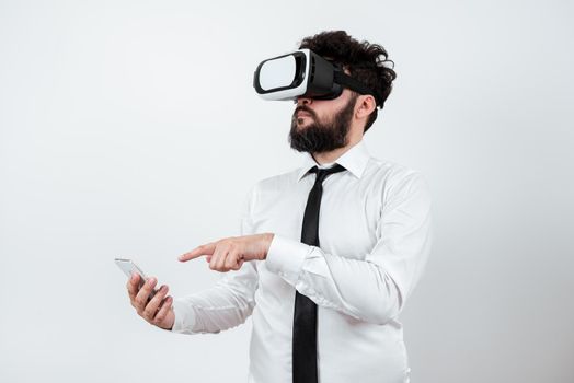 Man Holding Mobile Phone, Wearing Vr Glasses And Pointing On New Idea.