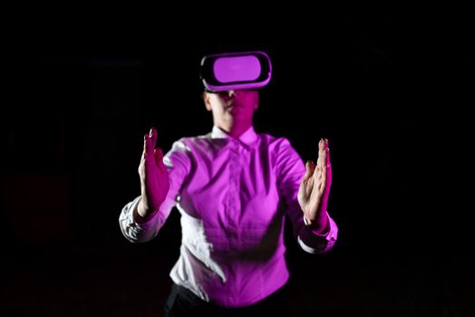 Woman Using Virtual Reality Simulator And Gesturing During Training.