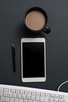 Phone Screen With Important Message On Desk With Keyboard, Pen And Coffee.