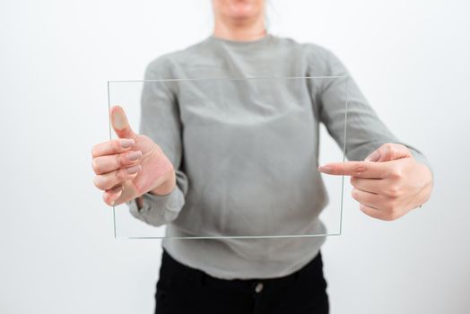 Businesswoman Pointing At Glass Banner And Promoting The Business.